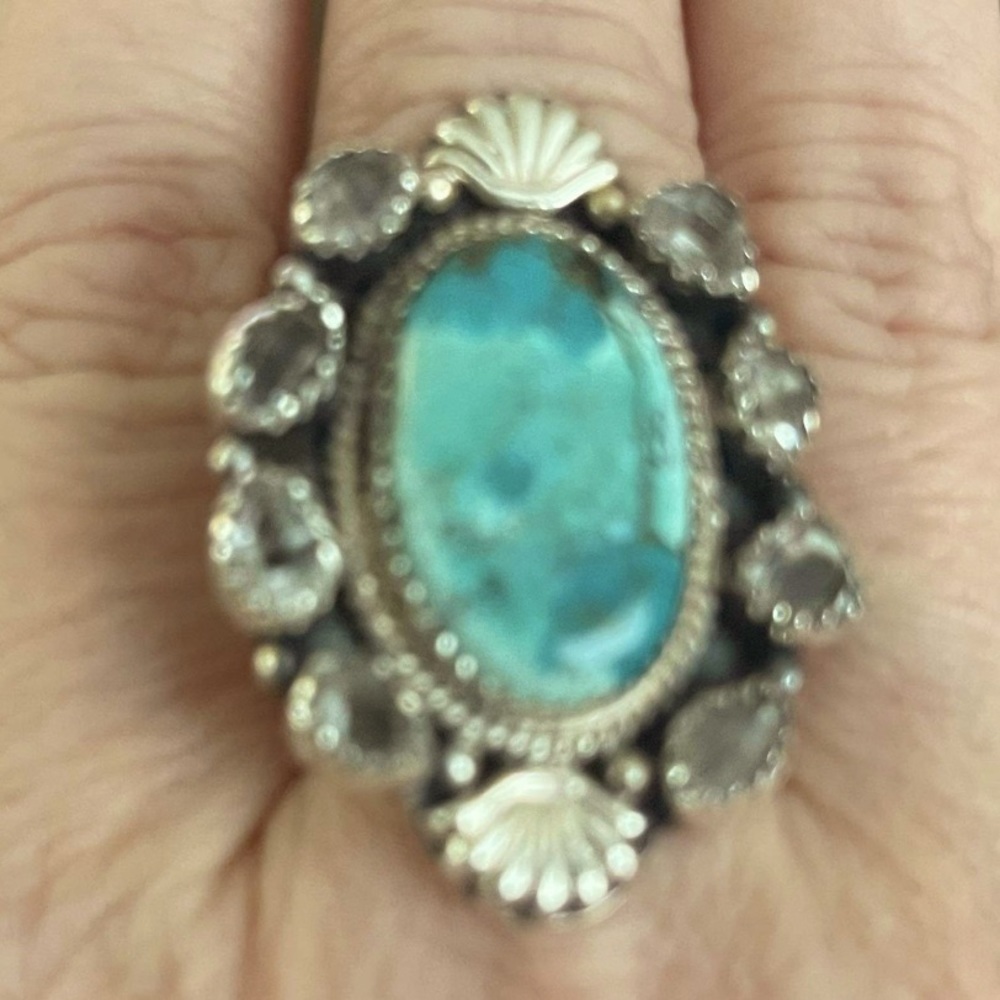 Adjustable sterling silver ring.